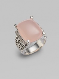 From the Wheaton Collection. A faceted cushion of milky pink opal, edged by rows of diamonds, in a wide cable band of sterling silver. Diamonds, 0.27 tcw Pink opal Sterling silver Width, about ½ Imported 