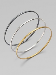 From the Skittle Collection. Three wispy hammered bangles - blackened and white sterling silver and 24k yellow gold - are minimalist in design with impactful results.24k yellow gold Sterling silver Imported