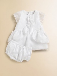 Crafted in the most lavish cotton, this angelic silhouette is adorned with cascading ruffles.Jewel necklineShort sleevesBack zipperDouble-tiered ruffle hemCottonDry cleanImported
