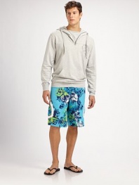 Classic swim trunk style comes to life in a bright floral print pattern, with side pocket detail in quick-drying nylon.Drawstring tie waistInseam, about 10Fully linedPolyesterMachine washImported