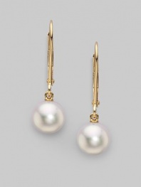 From the Akoya Collection. Classic white cultured pearl drops set in 18k gold. 7mm white round cultured pearls Quality: A+ 18k yellow gold Drop, about 1 Ear wire Imported