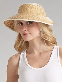 Packable wide brim raffia is accented with cotton ribbon detailing. About 4 brim Adjustable One size Spot clean Imported