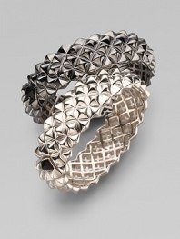 Fabulously crafted bangle of blackened sterling silver displays a sculptural stud pattern with one contrasting stud at the clasp. Sterling silver Diameter, about 2½ Width, about ¾ Hinged with clasp Imported Please note: Bracelets sold separately.