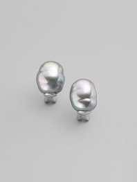 EXCLUSIVELY AT SAKS. Shapely and simple baroque pearls in soft grey make classic button earrings, in a sterling silver setting. 14mm organic man-made pearls Sterling silver Post and hinge back Made in Spain