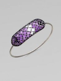 A bold, yet sleek style with a unique lattice pattern over glossy, colored glass. GlassSilverDiameter, about 2.5Hidden closureMade in Italy
