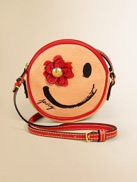 A fun face with a great big flower looks out from a canteen style crossbody bag that's just the right size.Top zip closureAdjustable buckle strap with contrast topstitchingRound body with screened smiley face and dimensional flowerLeather-look trimAbout 5½ diameter X ¾DCottonImported