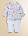 A whimsical floral print lends cute, sweet style to a girlie cotton tunic, paired perfectly with ruffled pants.Ruffled crewneckLong sleevesBack buttonsElastic waistband Pleated yokeRuffled hemElastic waistbandCottonMachine washImported Please note: Number of buttons/snaps may vary depending on size ordered 