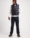 This smart puffer vest sports silvertone details and a lush down fill to protect you against all the elements.Mockneck collarSleevelessZip-front closureZippered side pocketsMesh interiorAbout 24½ from shoulder to hemNylonFill: 80% down/20% other feathersMachine washImported