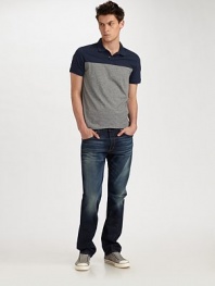 A slightly-slim version of the classic straight-leg fit, cut from premium American denim with hand-applied distressed detail at the points of wear. Five-pocket style Inseam, about 34 98% cotton/2% Lycra Machine wash Made in USA 