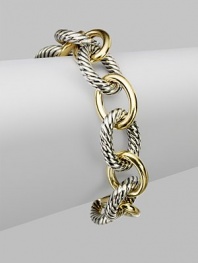 Extra large and extra lovely, this bold bracelet combines smooth 18k gold oval links with sterling silver cable links for a classic look with extra character. Sterling silver and 18k yellow gold Length, about 7½ Hidden spring clip clasp Made in USA