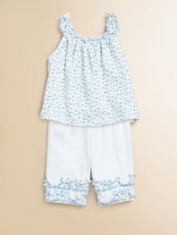 Dainty flowers and delicate ruffle trim makes for a pretty, yet comfortable, design for your little one. Scoopneck with ruffled trimSleevelessAllover floral printElastic waistbandSolid pant with floral ruffle trimPima cottonMachine washImported