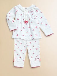 Rendered in ultra-soft cotton, this adorable feminine set is adorned with colorful flowers and bows.V-neckLong sleevesFront snapsElastic waistbandScalloped trim on cuffs and anklesCottonMachine washImported Please note: Number of snaps may vary depending on size ordered. Additional InformationKid's Apparel Size Guide 