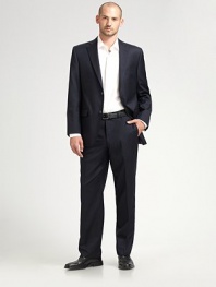 EXCLUSIVELY OURS. An essential look that travels as well as it wears, tailored in sophisticated wool super 120s that never goes out of style. Two-button closure Chest welt, waist flap pockets About 30¼ from shoulder to hem Loro Piana serge wool; dry clean Imported Additional Information Men's Suits Size Guide 