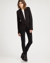 Sporty meets sleek in this elongated blazer with a tailored front and casual cropped back.V necklineFoldover lapelChest pocketSingle button closureFlap pocketBack elastic waist80% acetate/20% polyesterDry cleanImportedModel shown is 5'10 (177cm) wearing US size 4.OUR FIT MODEL RECOMMENDS ordering true size. 
