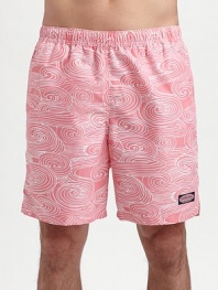 An eye-catching swirling pattern lends modern style to an easy-fitting swim favorite. Elastic waist with internal drawstring Side slash, back patch pockets Mesh lining Inseam, about 7 Polyester Machine wash Imported 