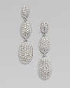 EXCLUSIVELY AT SAKS. From the Metropolitan Oval Collection. Three graceful ovals in graduated sizes are luxuriously paved with sparkling hand-set crystals. Crystal Rhodium plated Drop, about 1½ Post back Imported