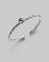 From the Noblesse Collection. Shimmering pavé diamonds frame a faceted blue topaz, delicately perched atop a cabled silver cuff. Diamonds, 0.14 tcw Blue topaz Cable, 5mm Sterling silver Diameter, about 2¼ Made in USA
