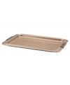 A cookie sheet that knows when to let go, this piece of bakeware is an essential for hassle-free cooking with a strong carbon steel core coated in a durable bronze nonstick finish that provides quick and effortless food release and fast cleaning. Designed with wide rimming along the edge, this cookie sheet is easy to maneuver and handle even with bulky oven mitts. Limited lifetime warranty.