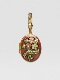 Topaz-colored CRYSTALLIZED - Swarovski Elements sparkle on this handcrafted, hand-enameled birthstone locket that opens to hold a favorite photo. Crystal Enamel 18k goldplated brass & brass-plated pewter Month indicated on the back Length, about 1¼ Width, about 1 Spring clip clasp Made in USA