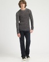 Soft, cozy texture woven from space-dyed cotton with a slim fit and button detail. Crewneck Cotton; hand wash Imported