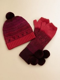 Soft and warm, with a cheery Nordic pattern and two bobbly pompoms. Thumb warmerPretty color paletteDry cleanImported