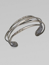 Slender, polished bands, sprinkled with Swarovski crystals, crisscross one another gracefully in this lovely cuff design.CrystalRuthenium platedDiameter, about 2¼Width, about ¾Imported