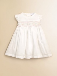 This design featuring beautiful rosebuds and elegant pleating is the perfect dress for your little one. Round necklineRuffled cap sleevesRosebuds with scalloped trimBack button closurePima cottonMachine washImported