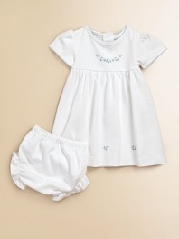 Make your little one look like a doll in this soft two-piece set with pretty scattered flowers. CrewneckShort sleevesScallop trim in contrasting toneEmpire waistBack snap closureBloomer with elastic waist and leg openingsPima cottonMachine washImported