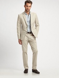 A staple of any man's closet, updated with a casual touch and tailored fit in stretch cotton twill. Two-button closureWaist welt pocketsTwo back ventsPartially linedAbout 27 from shoulder to hem95% cotton/5% polyesterDry cleanImported
