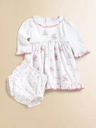 Your little princess will look the part in this charming pima cotton print right out of a fairy tale.Round neckline with embroidered ruffle Solid bodice with embroidery Empire waist with soft gathering Long sleeves with embroidered ruffles Contrast scalloped edging Back snaps Ruffled hem Bloomer in complementary print with elastic waist and leg openings Cotton Machine washImported Please note: Number of snaps may vary depending on size ordered.