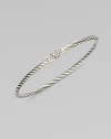 From the Cable Collectibles Collection. Thin sterling silver band with delicate diamond pavé heart.Diamond, 0.11 tcw Sterling silver Width, about 3mm Hook closure Imported 
