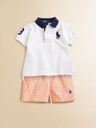 Essential cotton mesh polo, finished with an embroidered Big Pony and a twill player's 3 for preppy in-the-game style.Ribbed polo collarShort sleevesFront button placketUneven vented hemCottonMachine washImported Please note: number of buttons may vary depending on size ordered. 