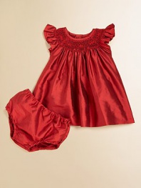 The perfect heirloom piece, in hand-smocked, finespun supple silk.Smocked jewel necklineFlutter cap sleevesMatching bloomers with elastic waistBack button closureSilkHand washImportedAdditional InformationKid's Apparel Size Guide 