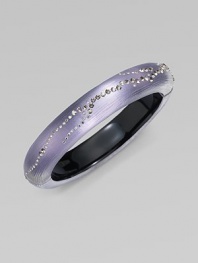 From the Lucite Lavender Dust Collection. A subtly textured, narrow bangle in soft wisteria, crafted of hand-sculpted, hand-painted Lucite, sprinkled with shimmering Swarovski crystals.LuciteCrystalDiameter, about 2¼Width, about ½Hinged with magnetic claspMade in USA