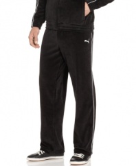 Kick back and greet the weekend in style with the ultimate comfort of these plush velour track pants from Puma.