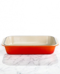 Roast and  boast. It's all in good taste when you roast your meat or prepare a lasagna in this enameled ceramic pan. The wide, shallow shape exposes a maximum area of food to the heat source, whether it be all around heat in the oven, under the broiler or on the stovetop for frying. Limited lifetime warranty.