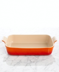 Straight from the oven to the table, this stoneware baker is built odor-, scratch- and stain-resistant, gracefully taking wear and tear in and out of the kitchen for a lifetime of use. The deep dish is ideal for lasagnas, casseroles and other layered entrees, but also offers more than function with a refined design and flared handles that give it centerpiece status. 5-year limited warranty.