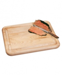 Get carried away with carving! This wooden carving board from Catskill provides plenty of space for larger roasts and poultry, eliminating messy prep with a juice reservoir around the perimeter. One-year warranty.