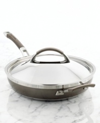 The go-to in a chef's kitchen. Whip up omelets, pancakes, sauteed vegetables, seared steaks and more on this versatile clad-constructed skillet, which sandwiches aluminum between two layers of stainless steel for fast, even heating. A silicone and stainless steel double-riveted handle lets you expertly maneuver food effortlessly off the nonstick surface and sloped sides. Lifetime warranty.
