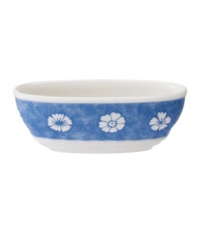 Vintage charm meets modern durability in the Farmhouse Touch amuse bouche bowl, featuring fresh white blooms on cornflower-blue porcelain from Villeroy & Boch.