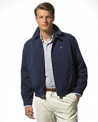 Classic fitting, zip-front windbreaker in high performance, sueded microfiber. Accented with tattersall cotton twill body lining. Buttoned throat latch, elastic waistband and buttoned cuffs. Slash pockets provide easy access and comfort. Inside pocket. Bi-swing construction for ease of movement. Polo's signature embroidered pony accents the chest.