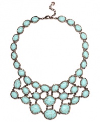 Spruce up your summer look in Monet's statement-making necklace. A rich bronze tone mixed metal setting provides the perfect backdrop for bold reconstituted turquoise stones. Approximate length: 17 inches + 2-inch extender. Approximate drop: 2-3/4 inches.