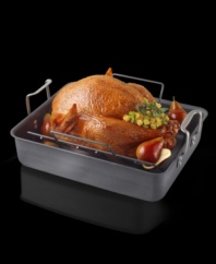 Meats, poultry and vegetables will cook to perfection in this heavy-duty pan. Like European roasters, it feature high sides to reduce splattering plus upright handles to facilitate lifting. The V-shaped rack elevates the main course for faster roasting and it helps keep crisp skins intact. Hard-anodized interior resists sticking and won't react to acidic ingredients, perfect for making rich pan gravies. 25 lb. capacity.