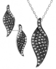 Turn over a new leaf! City by City conveys autumnal allure with this stylish leaf-themed set of post earrings and a pendant necklace. Crafted in nickel-free silver tone mixed metal, it's embellished with sparkling crystals. Approximate length: 15 inches + 3-inch extender (necklace). Approximate drop (pendant): 1-1/2 inches. Approximate diameter (earrings): 3/4 inch.