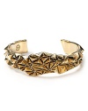 Crater spikes make a strong statement on this vintage-inspired cuff from House of Harlow 1960.