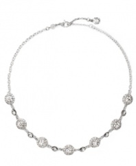 Stunning and sophisticated. Embellished with glittering clear glass accents and crystals, this necklace from Monet conveys a luxurious look. Crafted in silver tone mixed metal. Approximate length: 16 inches + 2-inch extender.