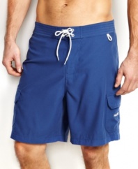 You'll be beach-ready with solid surf style with these swim shorts from Nautica.