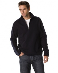 Long sleeved half zip knit sweater with ribbed collar. Nylon shoulder/arm detail, underarm vents. Side pockets.
