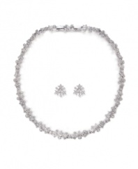 Celestially chic. Featuring a star motif, Swarovski's sparkling pavé crystal necklace and earrings set will add glamour to your holiday style. Set in silver tone mixed metal. Approximate necklace length: 15 inches. Approximate earring diameter: 1/2 inch.