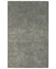 Expanding on classic rug motifs, this modern piece features a clean design of oversized leaves, virtually imprinted on an cool gray background. New Zealand wool is tufted by hand, creating a premium-quality rug with thick, dense pile.